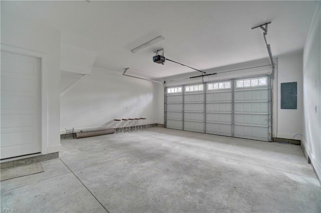 garage with electric panel and a garage door opener