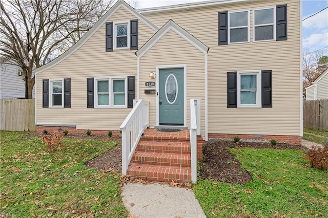 view of front of home with a front yard