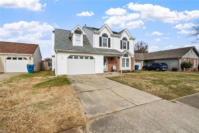 view of front property featuring a garage and a front lawn