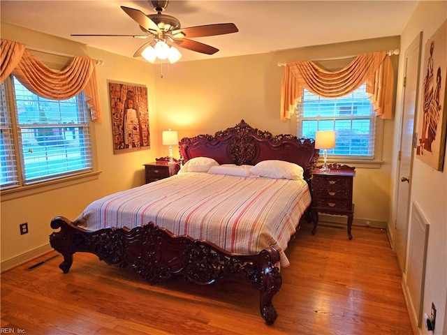 bedroom featuring light hardwood / wood-style flooring and ceiling fan