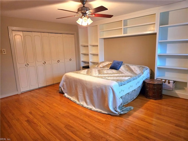 bedroom featuring ceiling fan, a closet, and light wood-type flooring