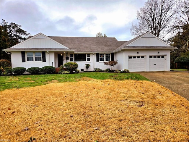 ranch-style home with a front yard and a garage