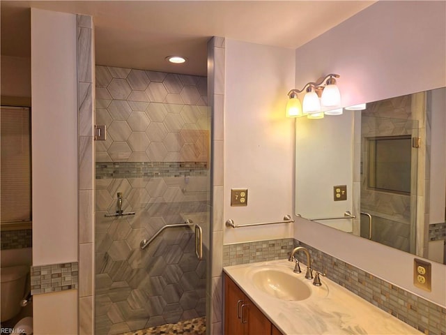 bathroom featuring vanity and tiled shower