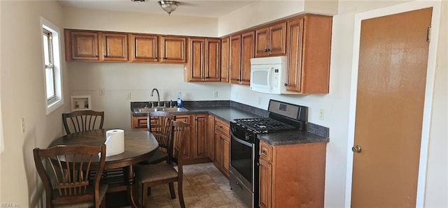 kitchen featuring black range with gas stovetop and sink