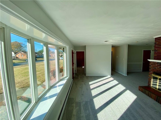 interior space with baseboard heating and a fireplace