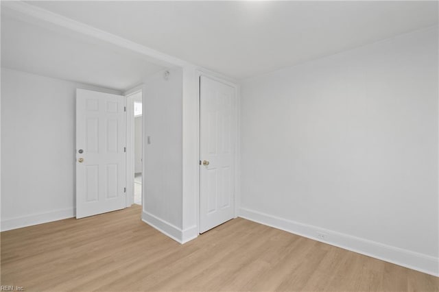 spare room with light hardwood / wood-style floors