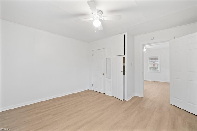 spare room featuring light wood-type flooring and ceiling fan