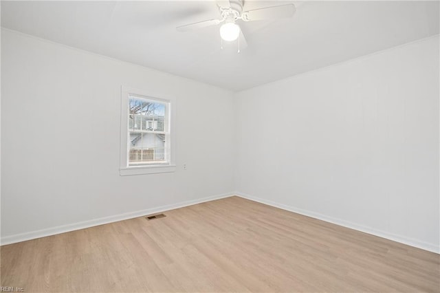 unfurnished room with ceiling fan and light wood-type flooring