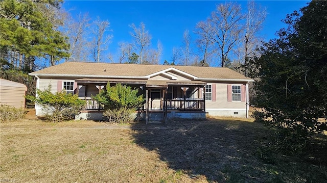 exterior space with covered porch and a front yard