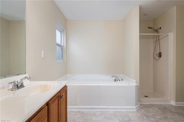 bathroom featuring tile patterned flooring, vanity, and independent shower and bath