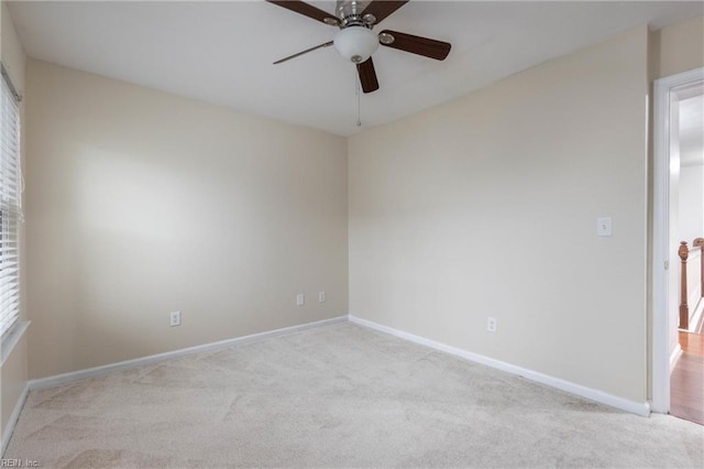 carpeted empty room with ceiling fan