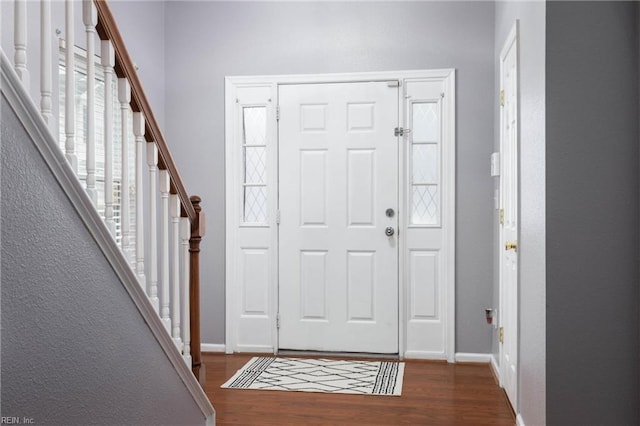 entrance foyer featuring dark hardwood / wood-style flooring