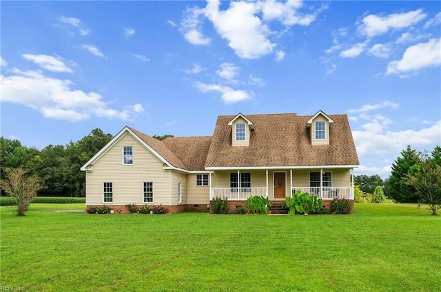 cape cod home featuring covered porch and a front lawn