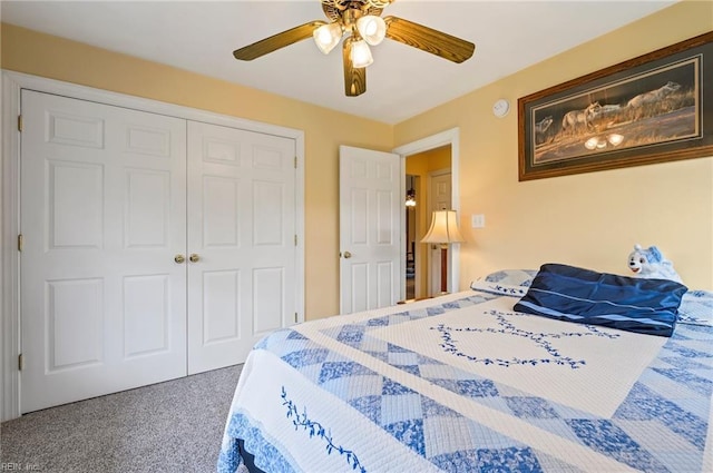 carpeted bedroom with a closet and ceiling fan