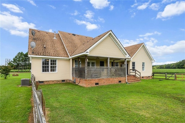 back of house with a lawn and cooling unit