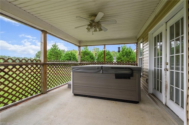 sunroom / solarium featuring ceiling fan