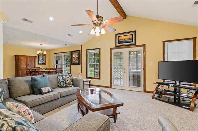 living room featuring lofted ceiling with beams, light carpet, ceiling fan with notable chandelier, and french doors