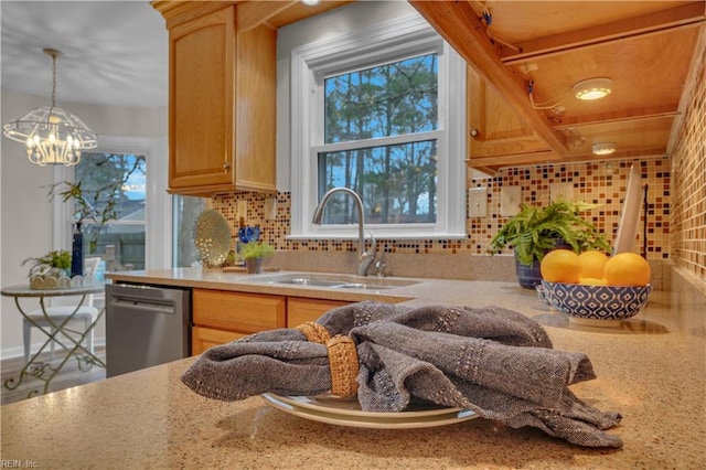 kitchen featuring dishwasher, light brown cabinets, sink, decorative backsplash, and a healthy amount of sunlight