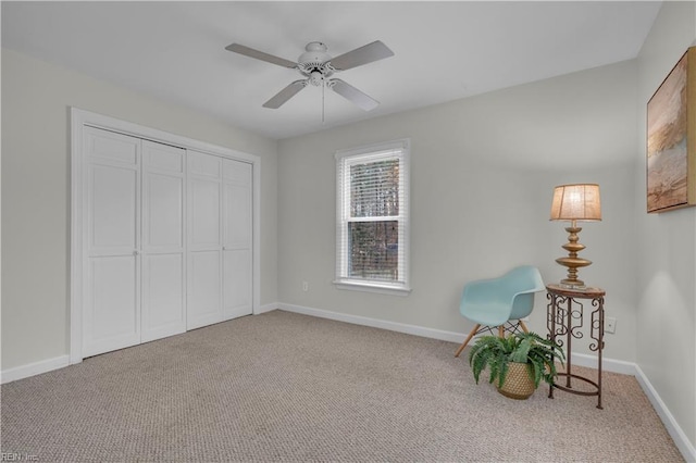 unfurnished room featuring ceiling fan and carpet floors