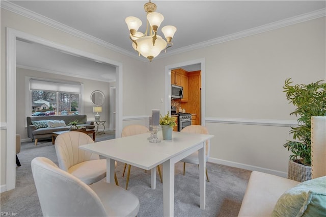 dining area featuring a chandelier, light carpet, and ornamental molding