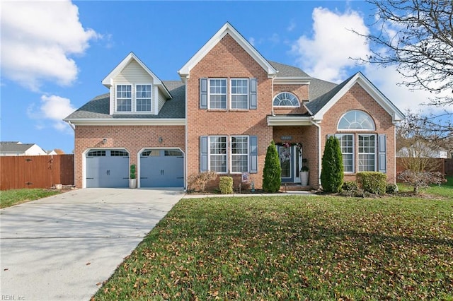 front facade with a front yard and a garage