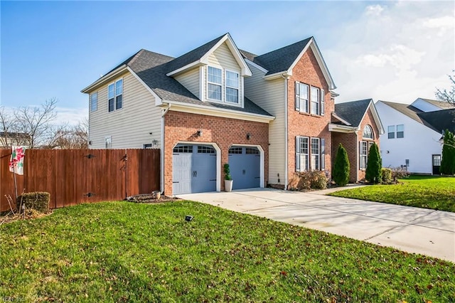 view of front of property featuring a garage and a front lawn