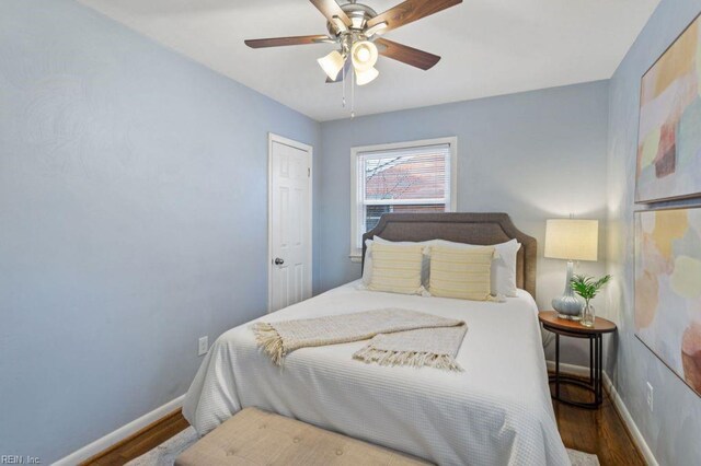 bedroom featuring hardwood / wood-style flooring and ceiling fan