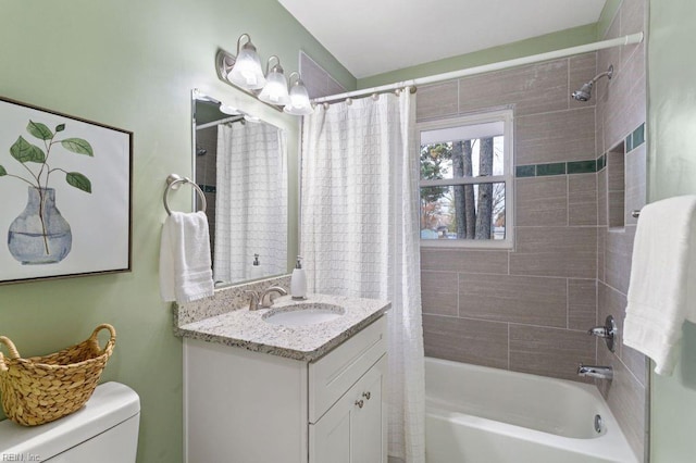 full bathroom featuring shower / bath combination with curtain, vanity, and toilet