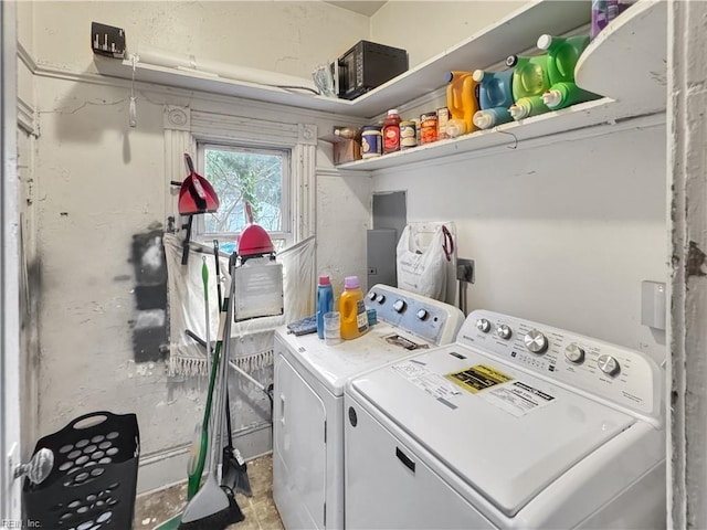 clothes washing area with washing machine and clothes dryer