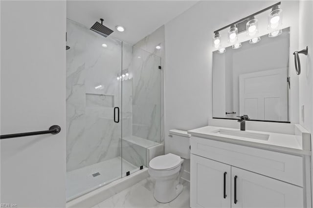 bathroom with vanity, an enclosed shower, and toilet