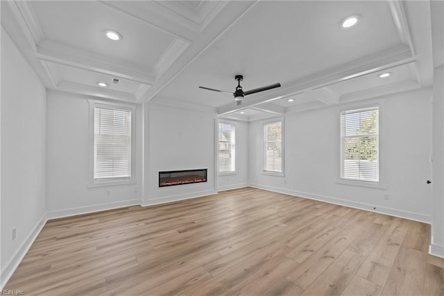 unfurnished living room featuring ceiling fan, light hardwood / wood-style floors, ornamental molding, and a wealth of natural light