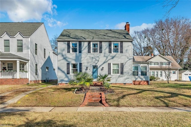 colonial home with a front yard