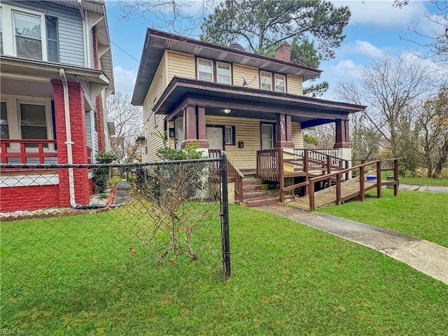 view of front of property featuring a front lawn and covered porch