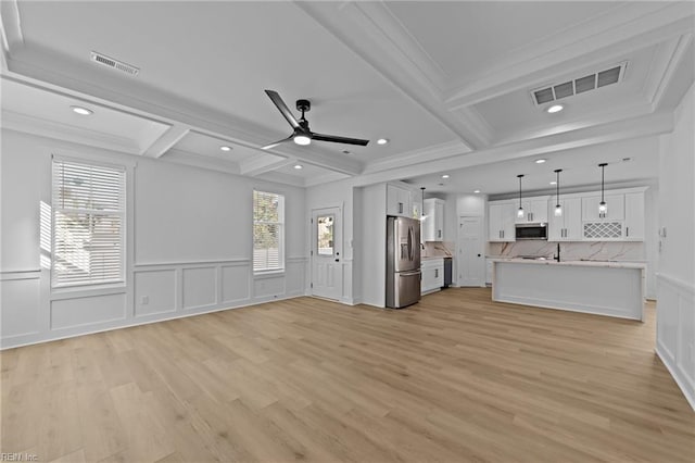 unfurnished living room featuring beam ceiling, ornamental molding, coffered ceiling, and light wood-type flooring