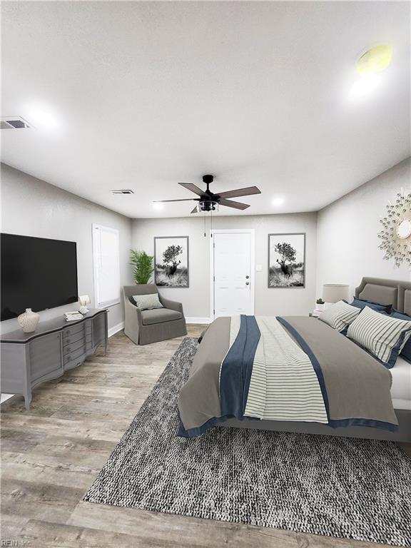 bedroom with light hardwood / wood-style floors and ceiling fan