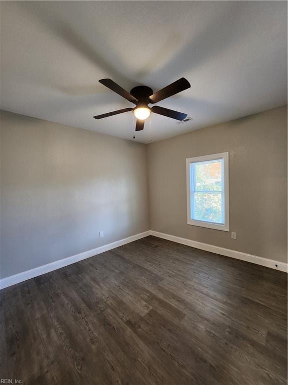 unfurnished room with ceiling fan and dark hardwood / wood-style floors