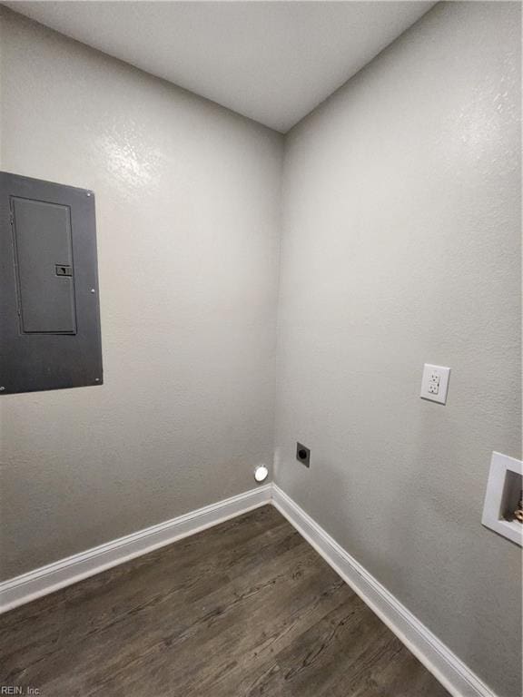 clothes washing area featuring hookup for an electric dryer, washer hookup, electric panel, and dark wood-type flooring