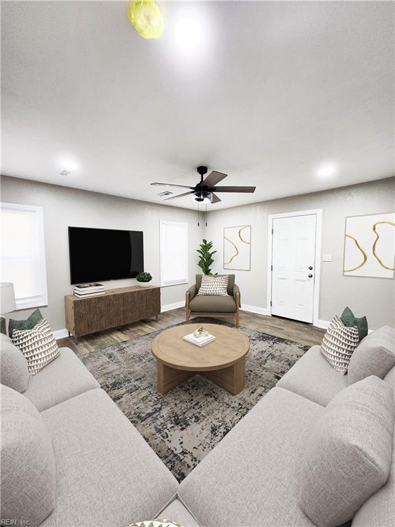 living room with ceiling fan and wood-type flooring