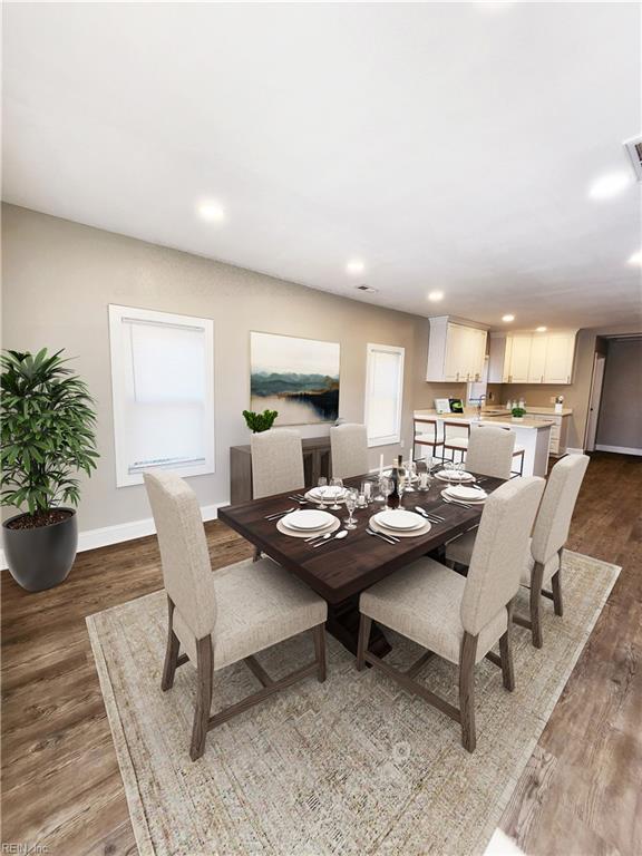 dining area with hardwood / wood-style flooring