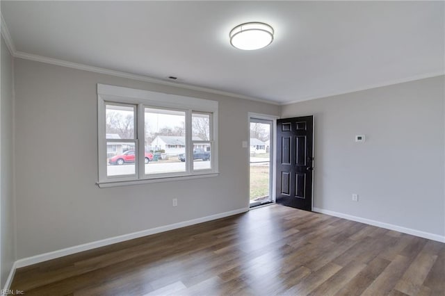 unfurnished room featuring dark hardwood / wood-style flooring and crown molding