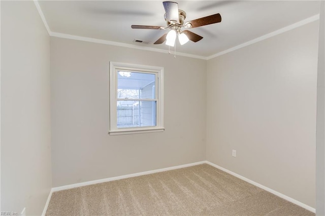 unfurnished room featuring crown molding, carpet, and ceiling fan