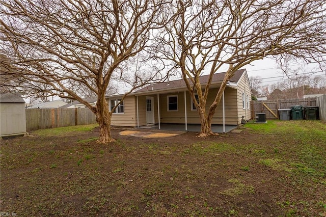 back of property featuring central air condition unit and a patio