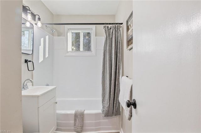 bathroom with vanity and shower / tub combo