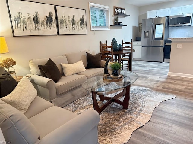 living room with light hardwood / wood-style floors