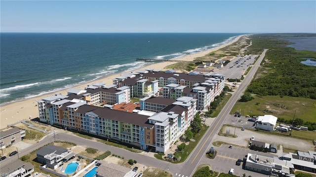 drone / aerial view with a water view and a view of the beach