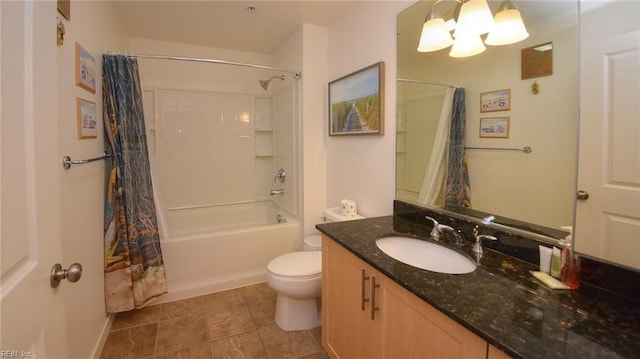 full bathroom featuring a chandelier, vanity, toilet, and shower / tub combo with curtain