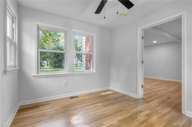 spare room with ceiling fan and light hardwood / wood-style floors