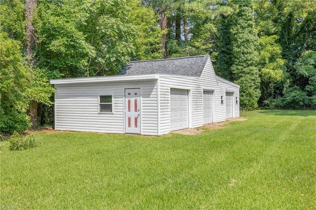 garage featuring a yard