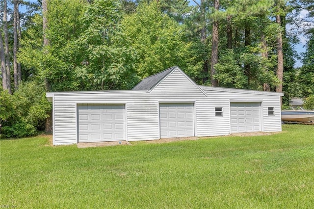 garage featuring a yard