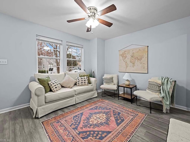 living room with ceiling fan and dark hardwood / wood-style floors